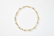 Gold twisted chain on a white background